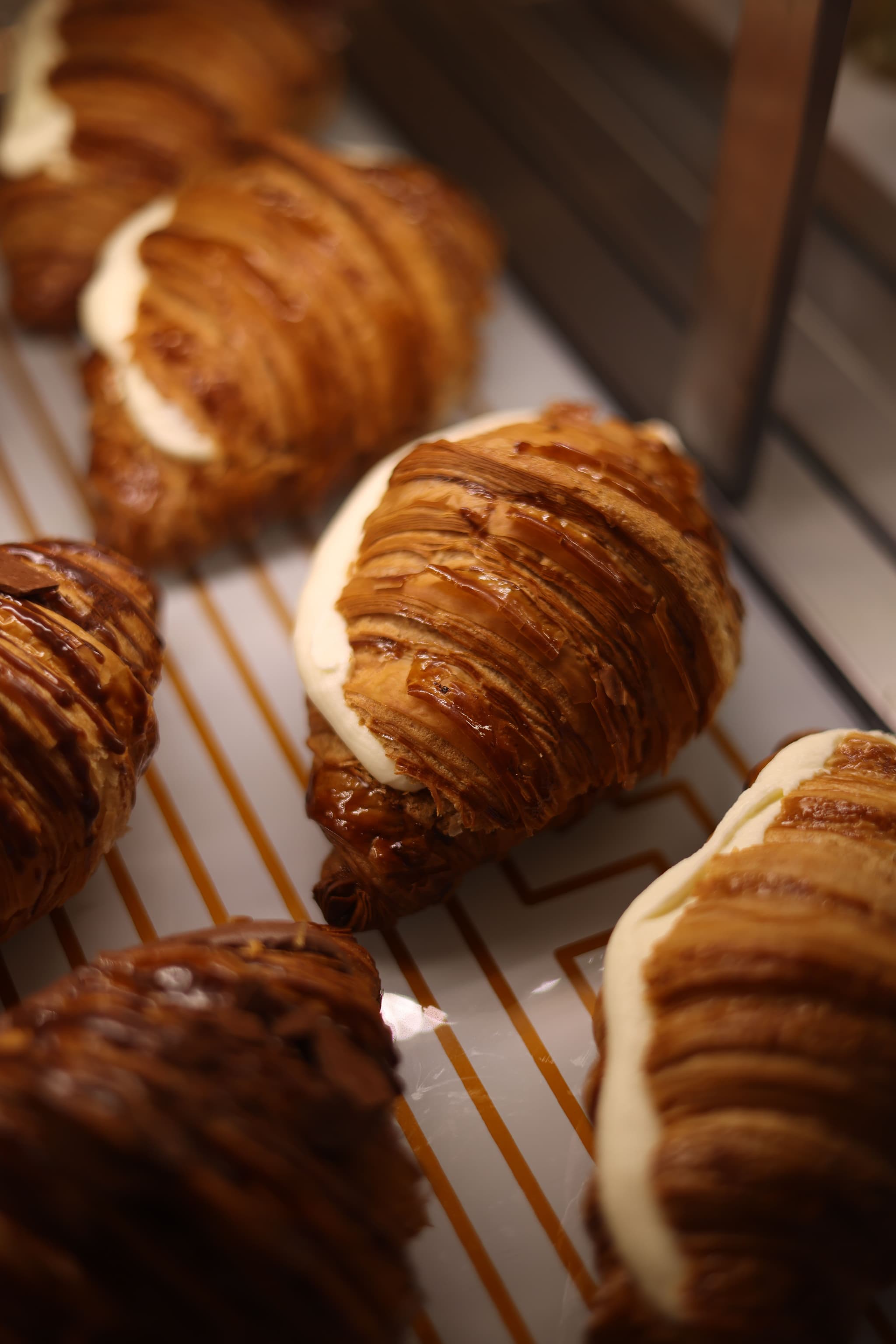 Fresh pastries on a cooling rack