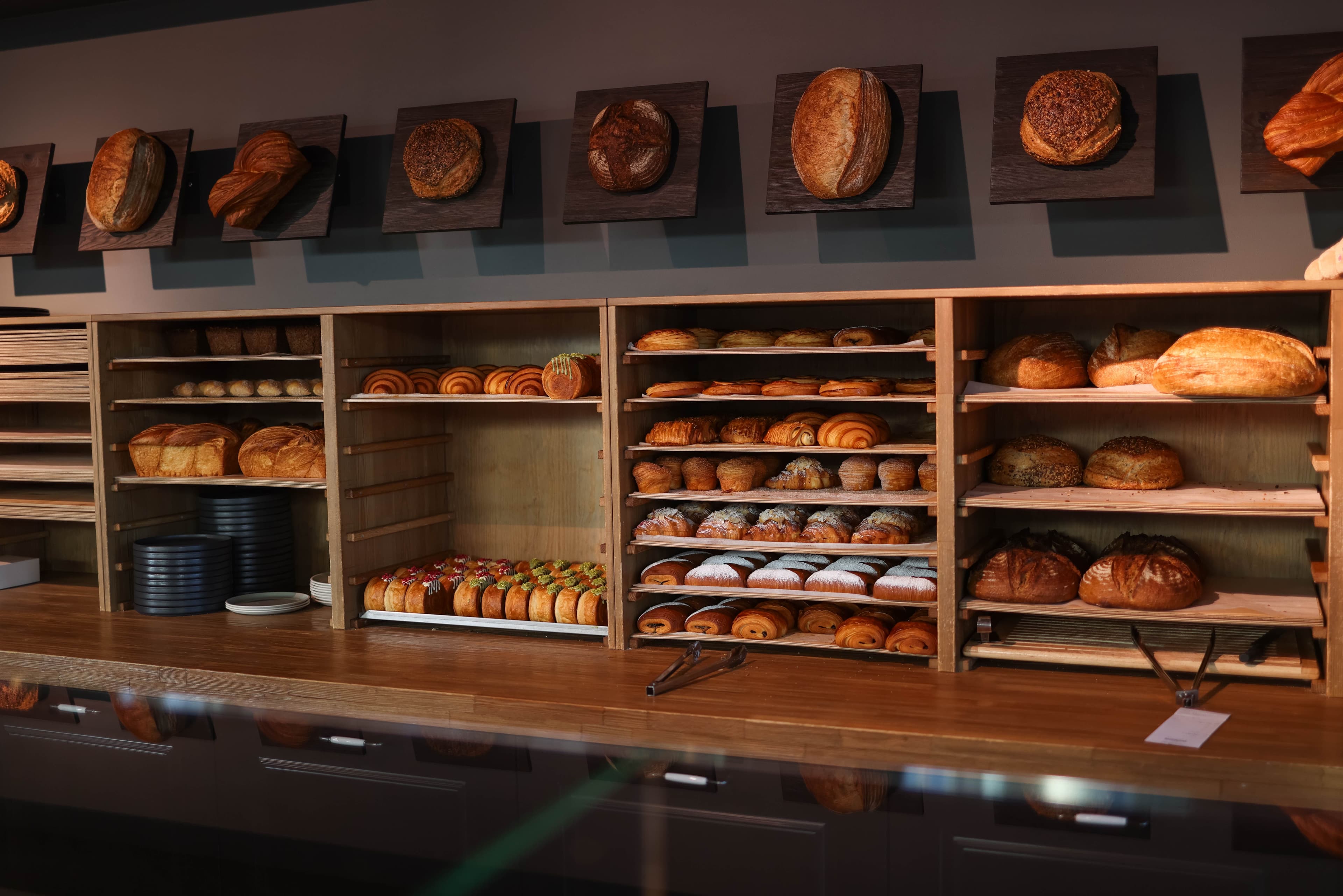 The red Miette and Miel corner bakery in the morning sun